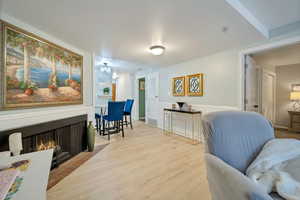 Living area with light hardwood / wood-style flooring