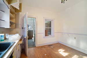 Kitchen featuring light wood-type flooring and sink