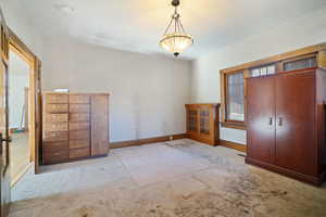 Unfurnished bedroom with a closet and light colored carpet