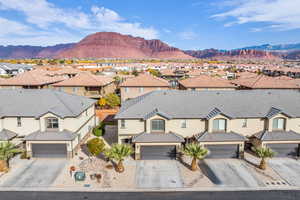 Birds eye view of property with a mountain view