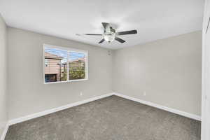 Unfurnished room with carpet flooring and ceiling fan