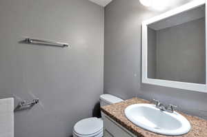 Bathroom with vanity and toilet