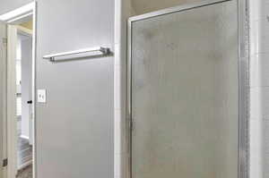 Bathroom with a shower with shower door