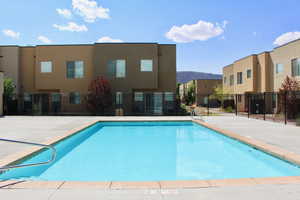 View of swimming pool featuring a mountain view and a patio