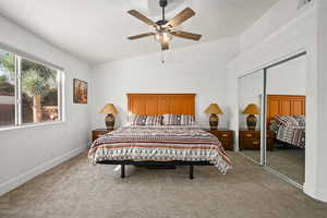 Bedroom featuring carpet flooring, ceiling fan, lofted ceiling, and a closet