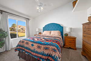 Bedroom featuring ceiling fan and carpet