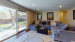 Living room with hardwood / wood-style flooring