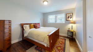 Bedroom featuring dark hardwood / wood-style floors