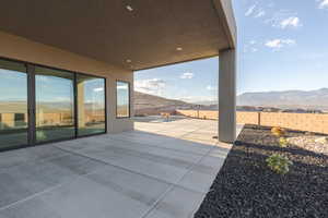 View of patio featuring a fenced backyard and a mountain view