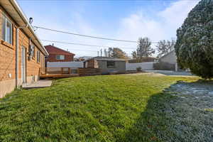 View of yard featuring a new wooden deck