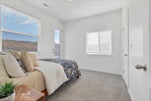 View of carpeted bedroom