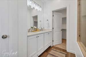 Bathroom with wood-type flooring and vanity