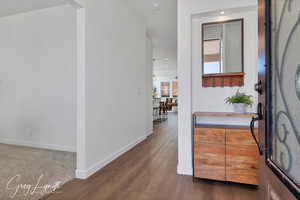 Entrance foyer featuring dark hardwood / wood-style flooring