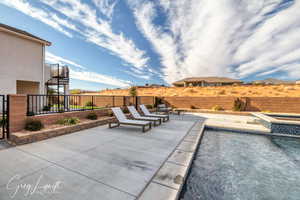 View of swimming pool with a patio area