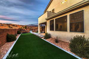 Yard at dusk featuring a mountain view