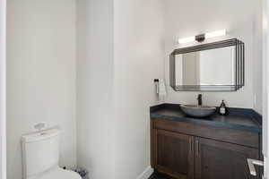 Bathroom with vanity and toilet