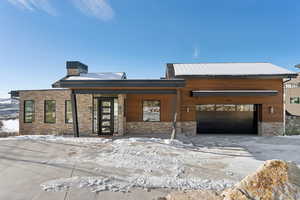 View of front of home featuring a garage