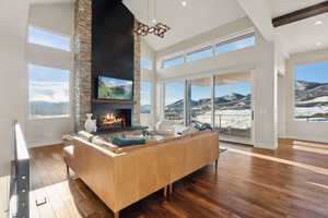 Living room featuring a wealth of natural light and dark hardwood / wood-style flooring