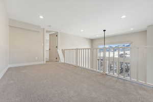 Unfurnished room featuring light colored carpet