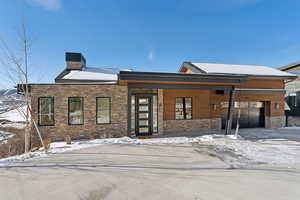 View of front facade featuring a garage