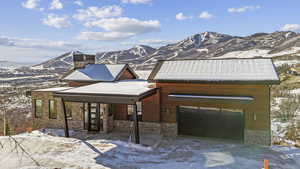 Exterior space featuring a mountain view and a garage