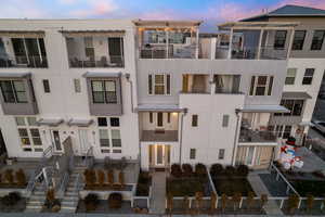 Outdoor building at dusk with central AC unit