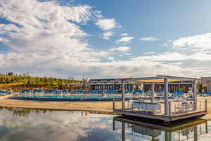 Dock area featuring a water view