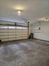 Garage featuring a garage door opener