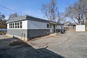 View of front of home featuring a shed