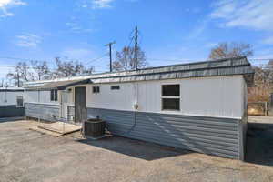 Back of property with central air condition unit