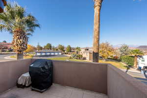 Balcony with a mountain view and area for grilling