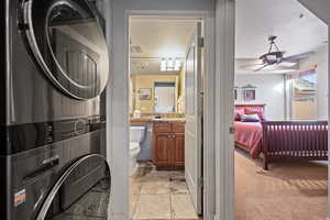 Bathroom featuring vanity, toilet, and ceiling fan