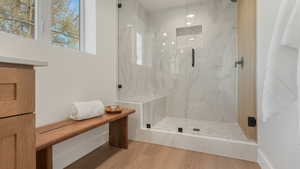 Bathroom with wood-type flooring and walk in shower