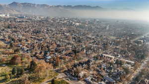 Birds eye view of property with a mountain view