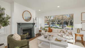 Living room featuring wood-type flooring and plenty of natural light