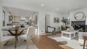 Dining area featuring a fireplace, light hardwood / wood-style flooring, and sink