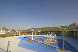 View of home's community featuring a playground