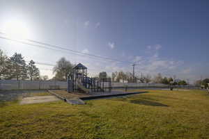 View of playground featuring a yard