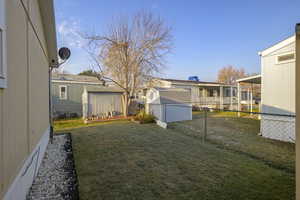 View of yard featuring a shed