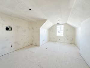 Bonus room featuring vaulted ceiling