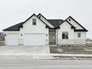 View of front of home featuring driveway and an attached garage