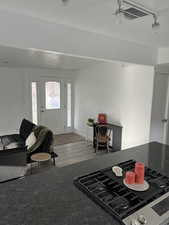 Living area with wood finished floors