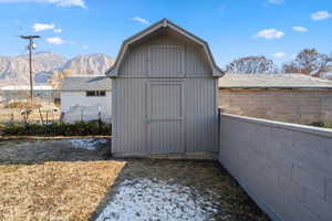 View of outbuilding with a mountain view