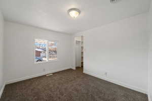 View of carpeted spare room