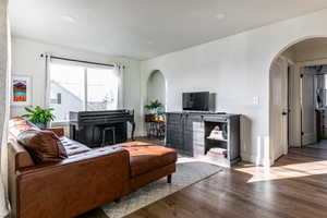 Living room featuring a textured ceiling and hardwood / wood-style flooring