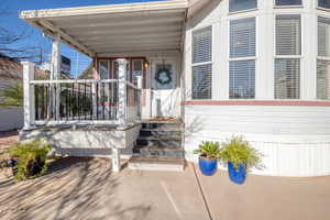 Entrance to property with a porch