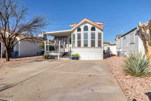 Rear view of house with covered porch