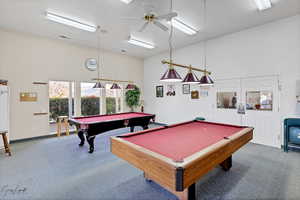 Game room featuring carpet flooring, ceiling fan, and billiards