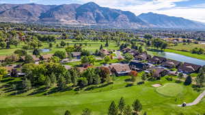 Aerial view with a water and mountain view and Golf Course