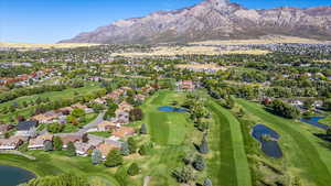 Birds eye view of property featuring a water and mountain view and Golf Course